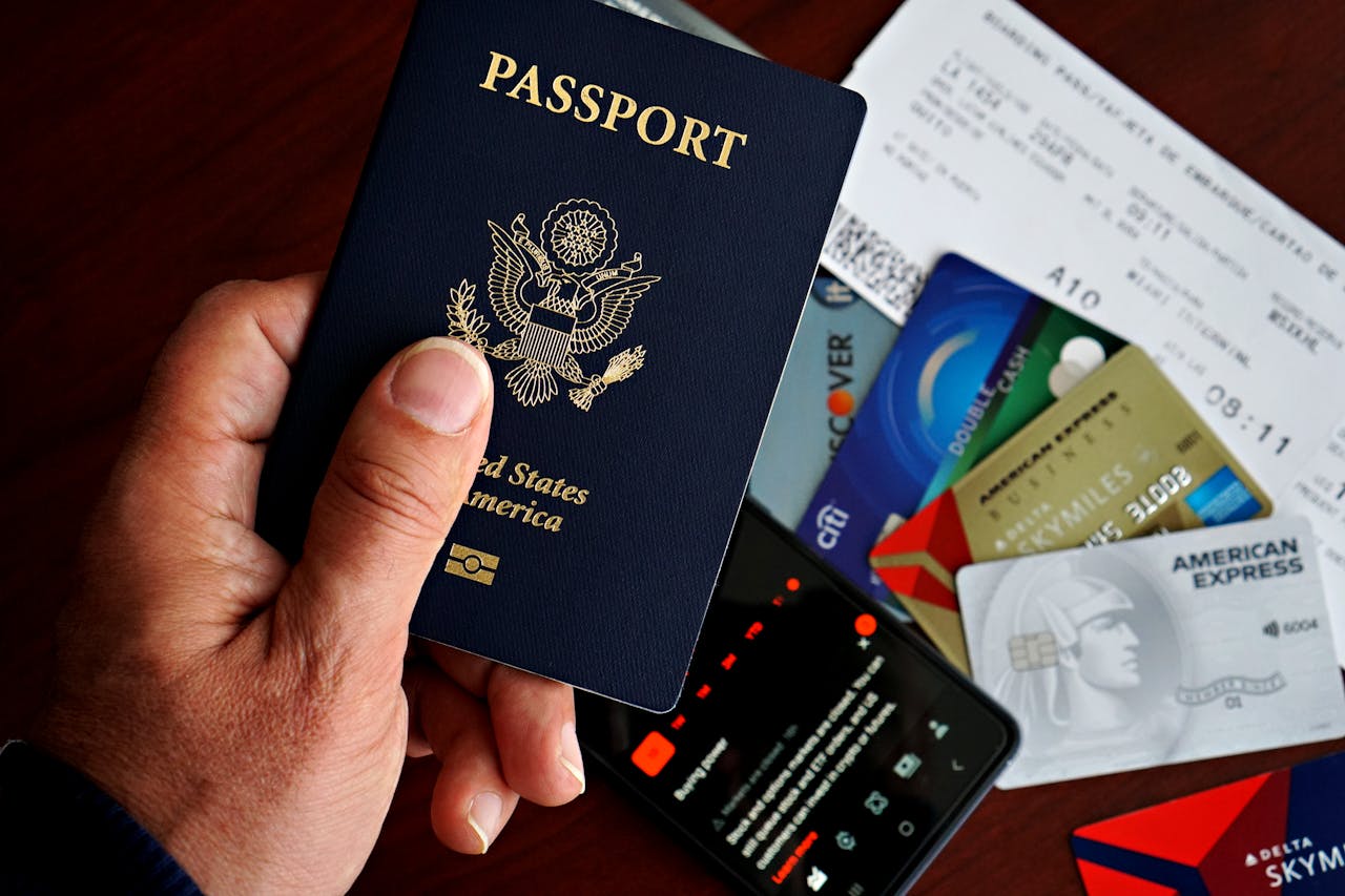 services-02 US passport with credit cards and travel documents on a table, travel preparation concept.